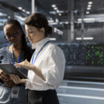 Data center recruiting team reviewing mission-critical infrastructure roles inside a server room