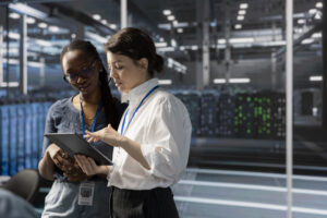 Data center recruiting team reviewing mission-critical infrastructure roles inside a server room