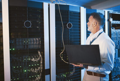 Critical facilities technician monitoring data center systems to protect uptime