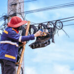 Fiber technician working on FTTH staffing and last-mile fiber deployment support