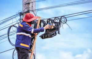 Fiber technician working on FTTH staffing and last-mile fiber deployment support