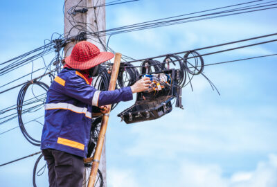 Fiber technician working on FTTH staffing and last-mile fiber deployment support