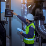 Mechanical engineer reviewing data center cooling systems and critical infrastructure