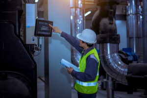 Mechanical engineer reviewing data center cooling systems and critical infrastructure