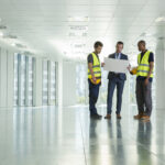 Director of in-building wireless reviewing DAS project plans with an engineering team