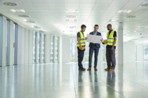 Director of in-building wireless reviewing DAS project plans with an engineering team