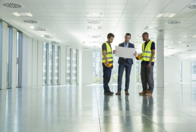 Director of in-building wireless reviewing DAS project plans with an engineering team