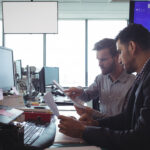 Wireless operations leaders reviewing a network deployment plan