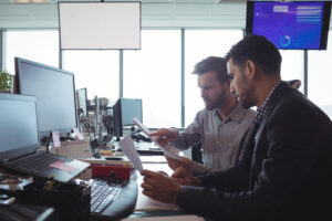 Wireless operations leaders reviewing a network deployment plan