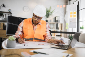 Fiber project coordinator reviewing OSP permits and construction documents