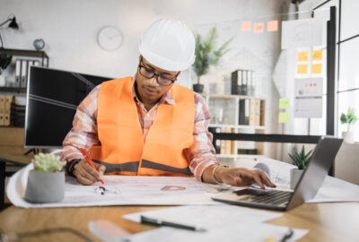 Fiber project coordinator reviewing OSP permits and construction documents