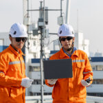 Wireless engineers planning a mid-band spectrum deployment near cellular network equipment