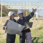 Fiber design engineer and OSP engineer reviewing broadband network plans and field routes