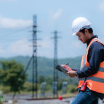 Fiber QA/QC inspector reviewing fiber construction in the field