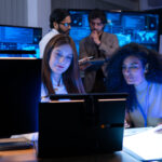 Wireless network operations team monitoring network performance in a 24/7 operations center