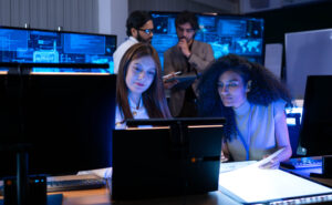 Wireless network operations team monitoring network performance in a 24/7 operations center