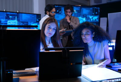 Wireless network operations team monitoring network performance in a 24/7 operations center