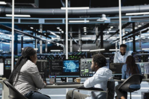 Data center NOC analyst monitoring network and infrastructure alerts
