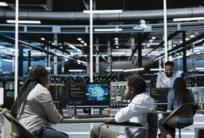 Data center NOC analyst monitoring network and infrastructure alerts