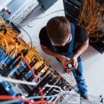 Fiber technician testing a connection during fiber network turn-up