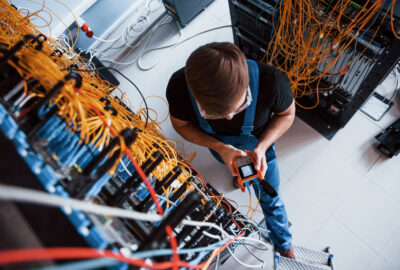 Fiber technician testing a connection during fiber network turn-up
