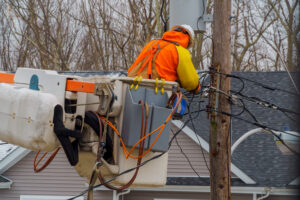 Fiber technician repairing network infrastructure after a storm outage