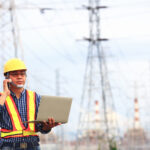 RF drive test engineer using a laptop to evaluate 5G network performance