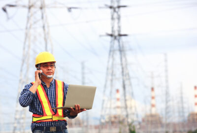 RF drive test engineer using a laptop to evaluate 5G network performance